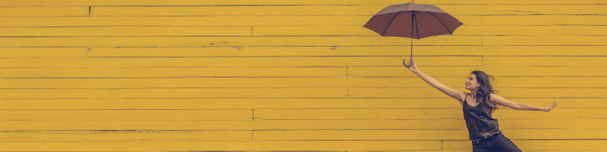 Woman flying with umbrella